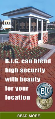 Security booth with windows on top half and bricks on bottom half